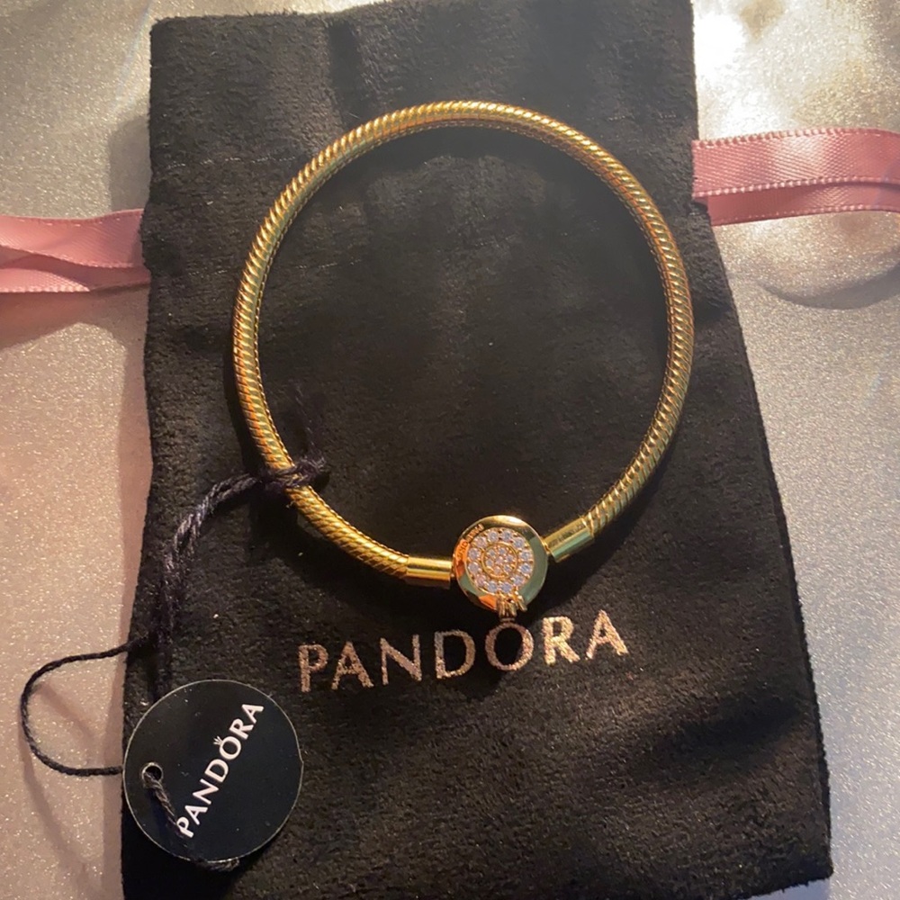Gold plated Pandora charm bracelet